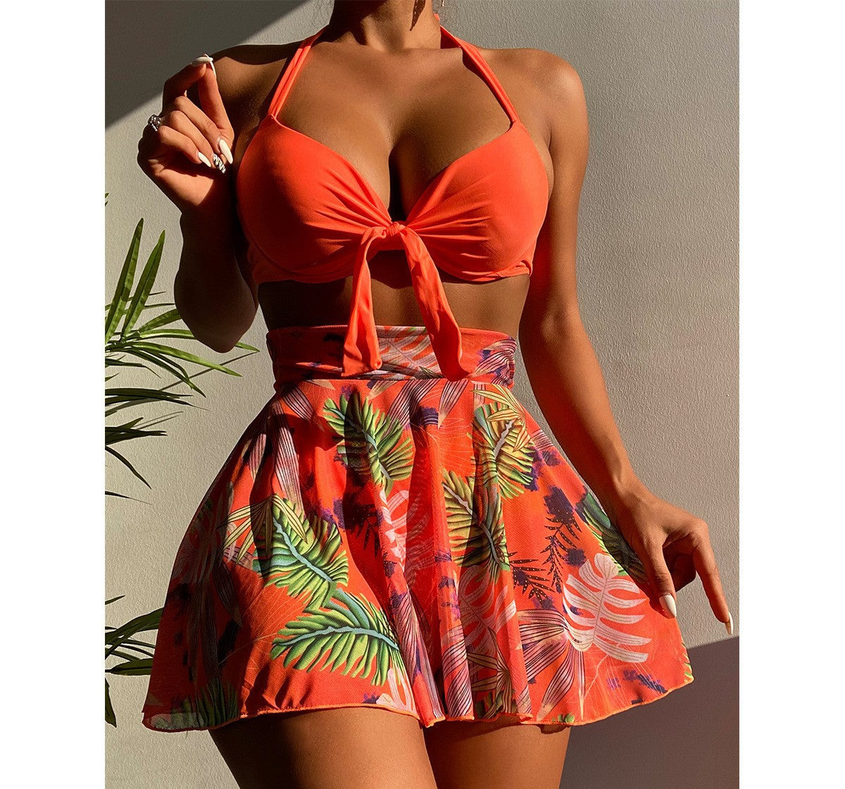 Croatia HZ NA-19 bikini set in Red, tropical leaf print skirt, outdoors